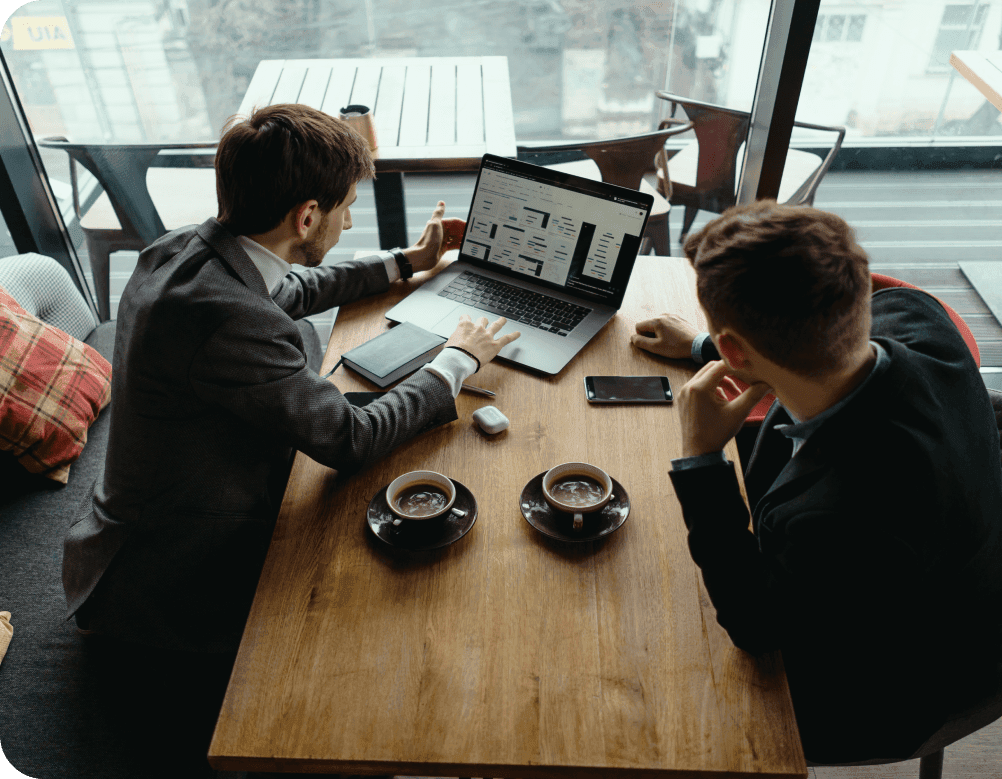 Photo showing two employees of Our Company at work